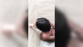 This girl gets hot in the shower, she touches and masturbates her pink pussy after leaving her very