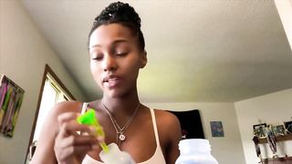 Cute young Ebony pumps her titty milk for Youtube