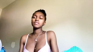 Cute young Ebony pumps her titty milk for Youtube